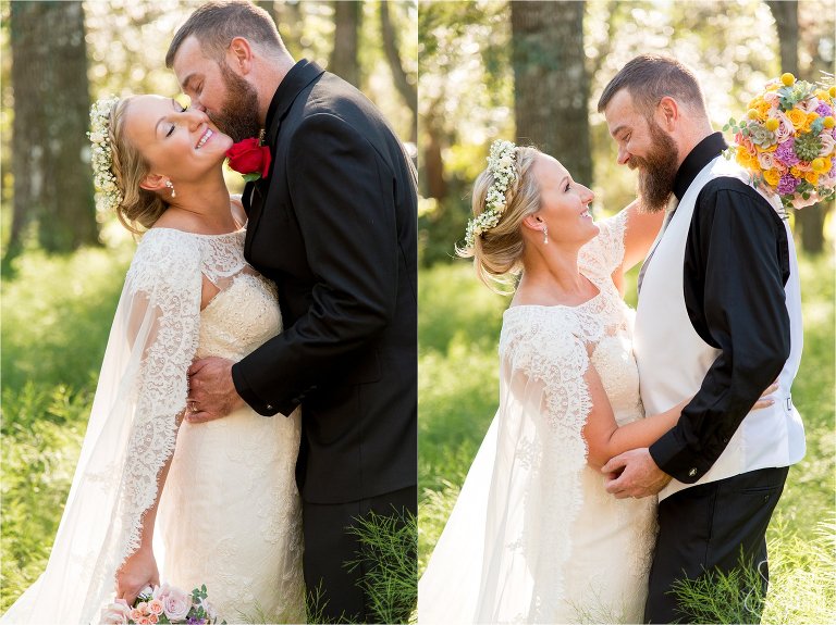 Bride and groom kissing and hugging in field of flowers