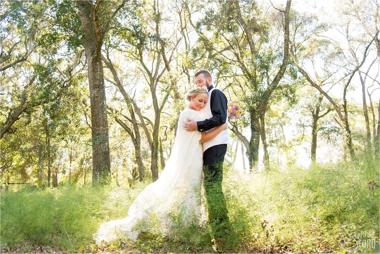 Bride and groom embrace at Harmony Gardens Wedding