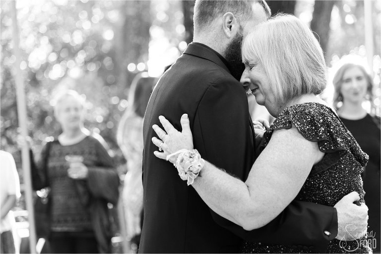 Father and mother dance together in garden