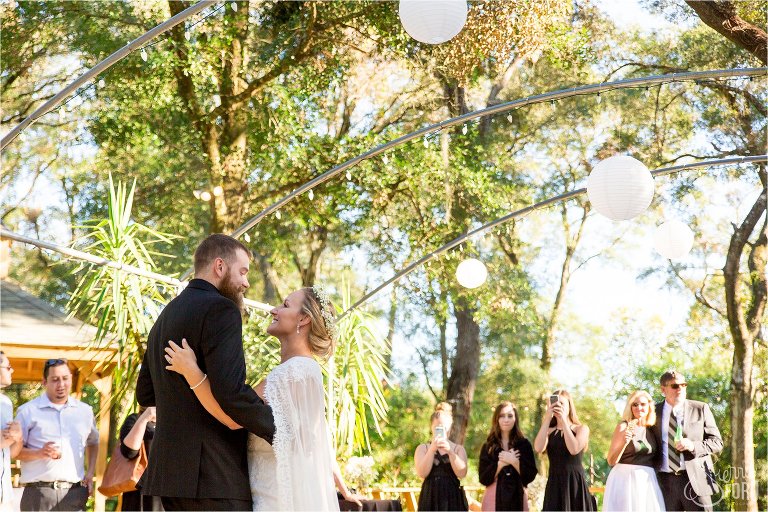 Bride and groom share first dance at harmony gardens