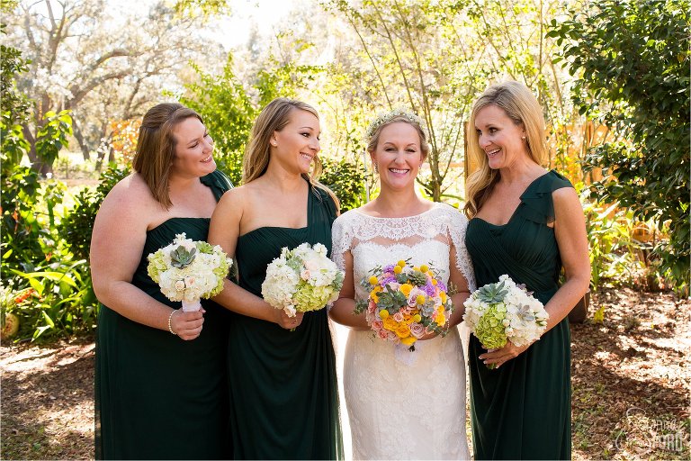 Bridemaids with bride posing and smiling