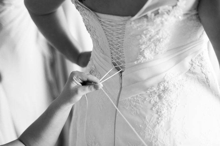 putting on dress