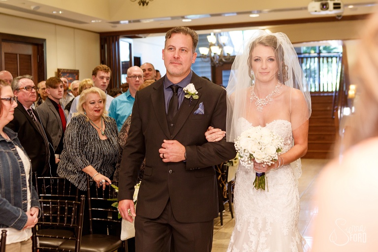 Bride and father walking down aisle