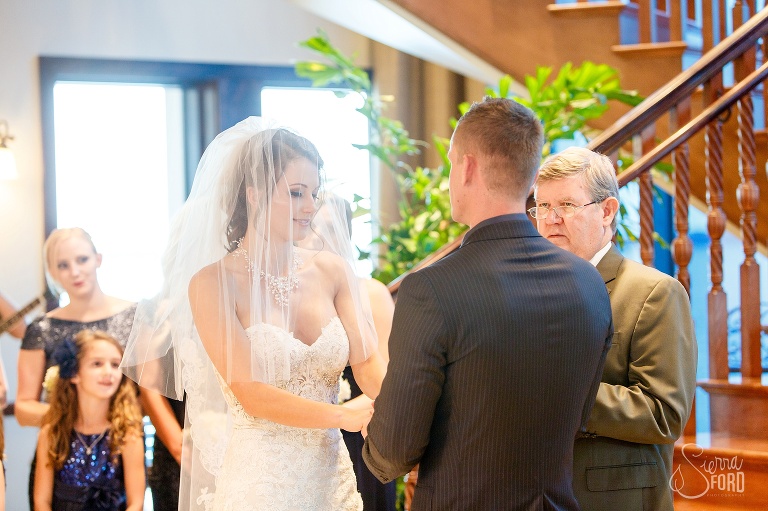 Bride and groom standing at altar