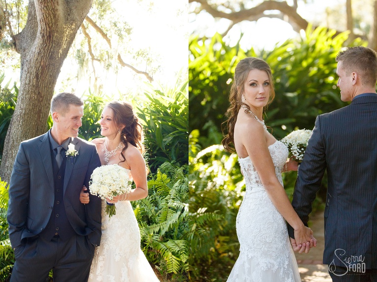 Bride and groom walking through garden at Tavares Pavilion