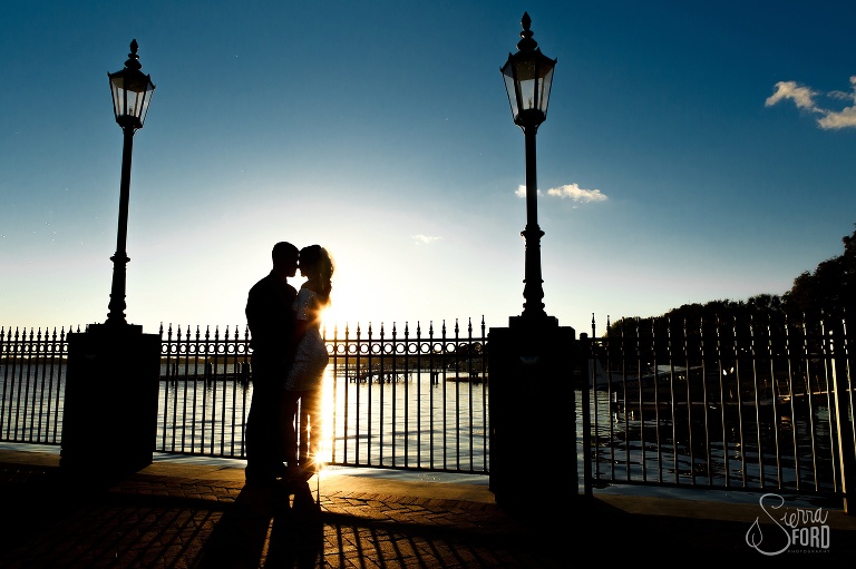 Bride and groom silhouette on lake at Tavares Pavilion wedding