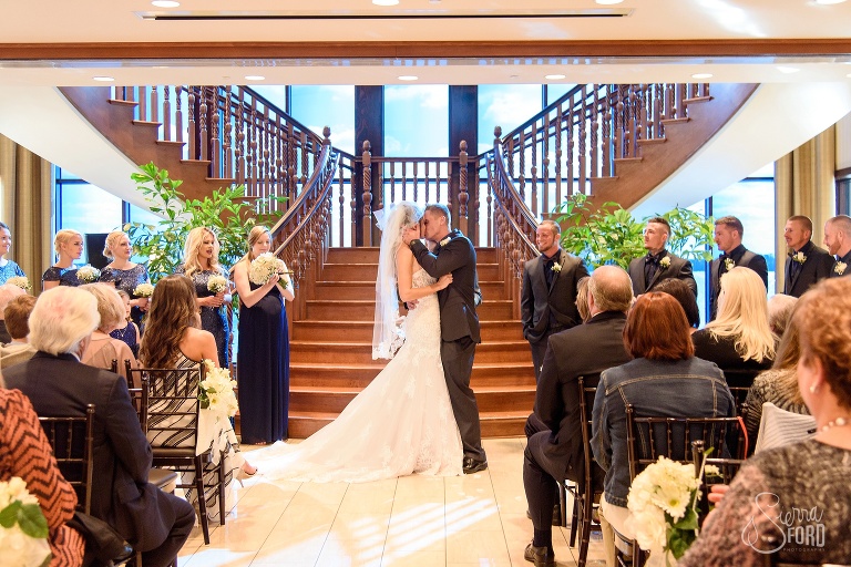 Bride and groom share first kiss