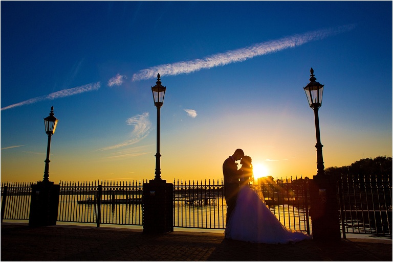 Bride and groom spending a quiet moment alone at sunset