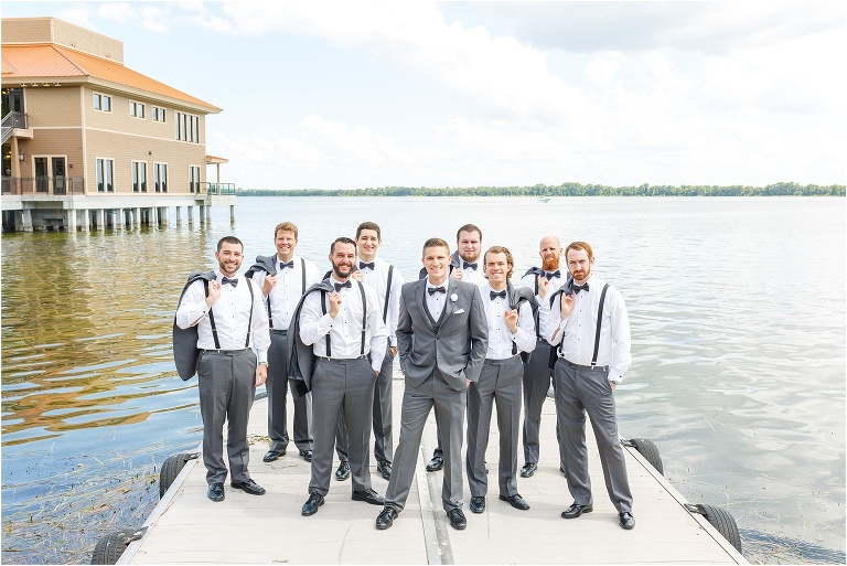 Groom and his groomsmen looking dapper on the boat dock