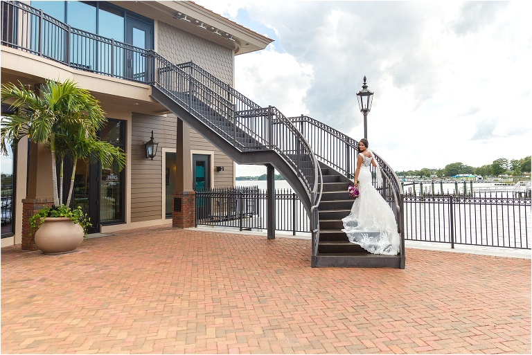 Bride standing on staircase of tavares pavilion pier