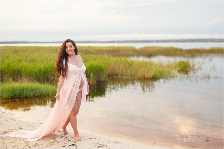 Mom strolling down the beach during sunset