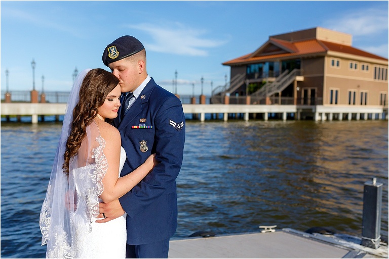 Bride & groom share a moment on the dock outside Tavares Pavilion
