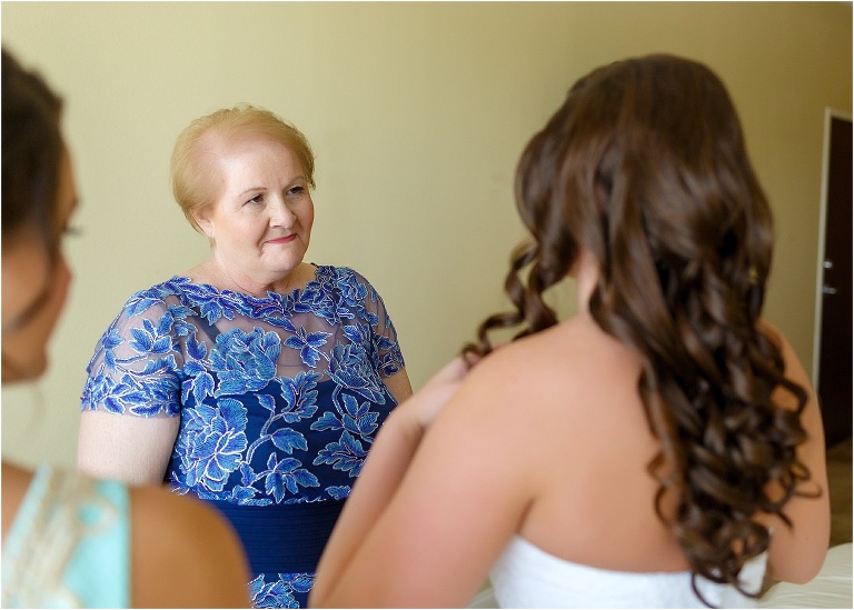 Mother of the bride looking proudly at her daughter in her wedding dress at Key West Resort