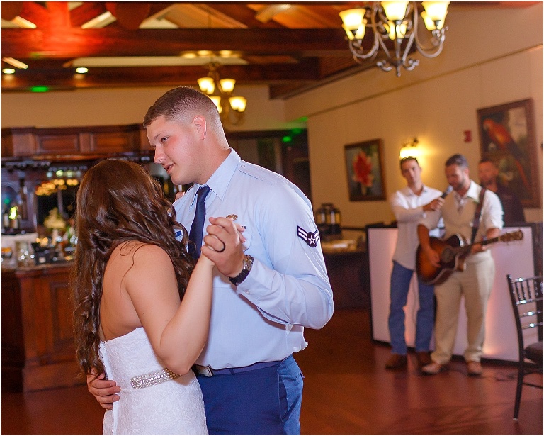 Bride & groom dancing to their last song played by their friend and groomsmen on his guitar