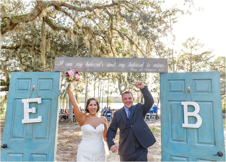 The now husband and wife burst through the doors with excitement!