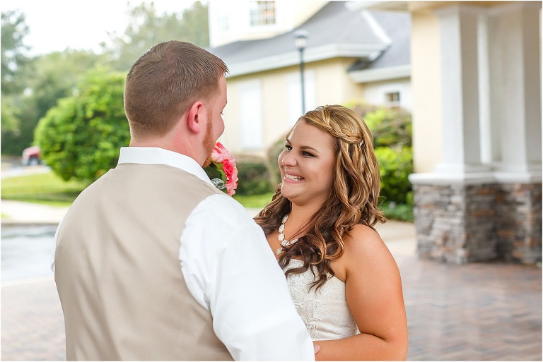 the bride smiles at her future husband with tears in her eyes