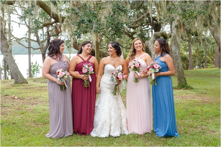 Bridesmaids in multi colored bridesmaid's dresses