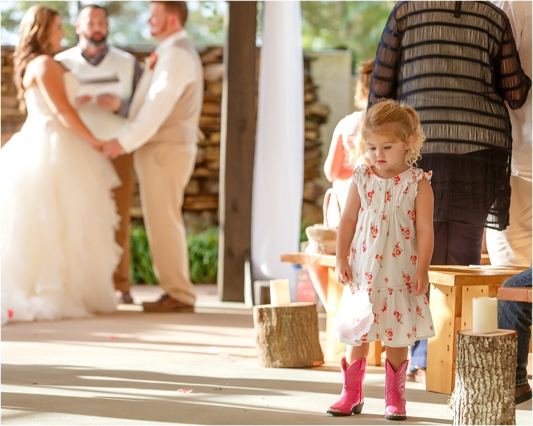 one of the younger guests gets a little distracted from the vows