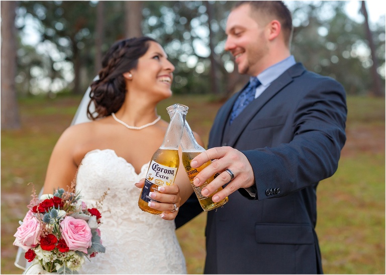 Bride and groom share Coronas at Doe Lake Campground before their reception