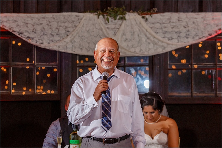Father of the bride gives a blessing at Doe Lake Reception