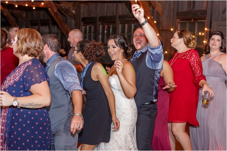 The bride and the groom caught in the middle of a conga line