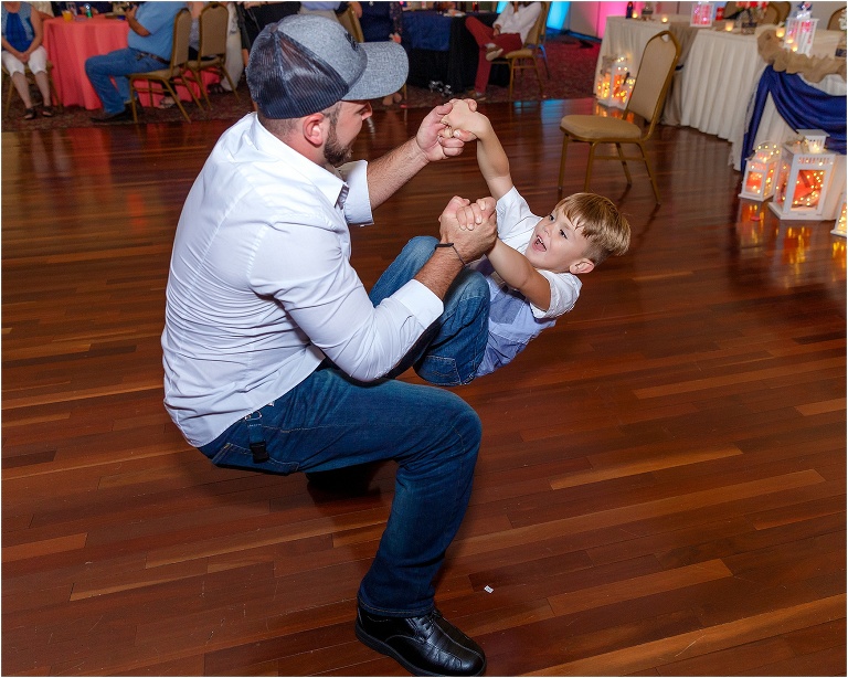 a guest showing off his dance moves with his son