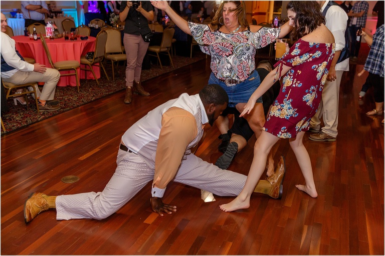 DJ George Davis shows off his splits during the reception