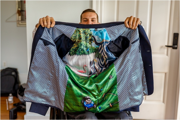 the groom shows off the Floridian backyard landscape design on the inside of his suit jacket