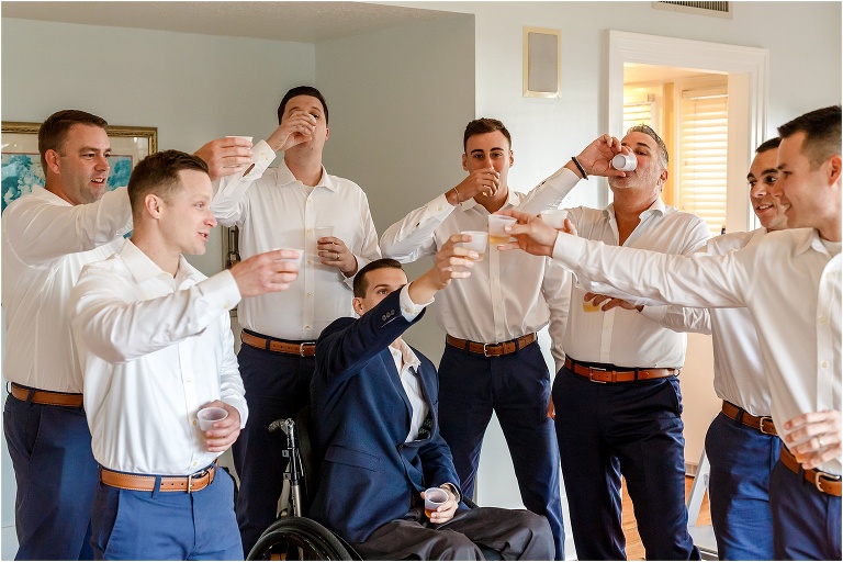 the groom & his groomsmen take a shot before the ceremony at Cypress Grove 