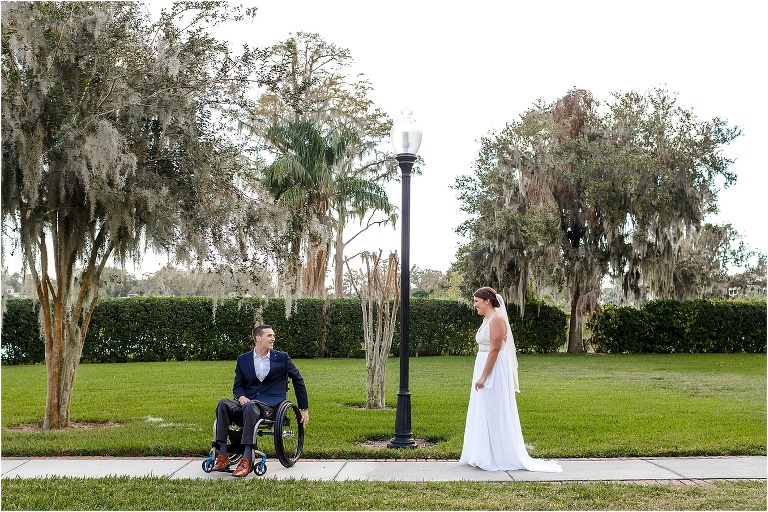 the groom turns around to see his bride for the first time under a lamppost at Cypress Grove Estate House