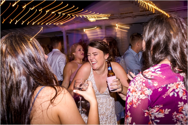 the bride laughs and shows off her dance moves during their Cypress Grove Estate House wedding reception