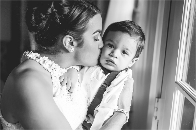 the bride kissing her son on the cheek