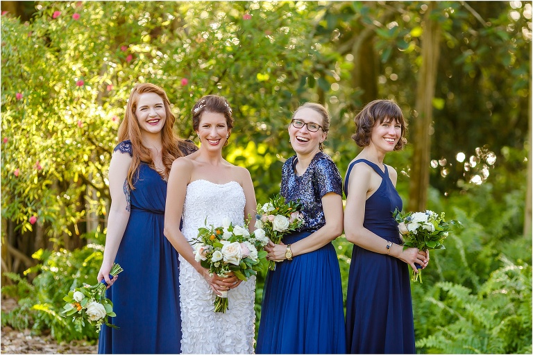 the bride shares a laugh with her gorgeous bridesmaids