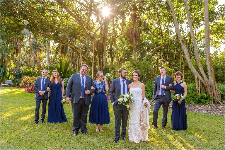 the beautiful wedding party with their navy blue dresses and suits