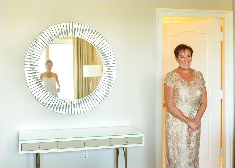 Mother of the bride looks lovingly at her gorgeous daughter