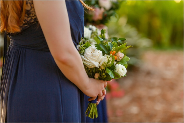 bridesmaid holding gorgeous bouquets