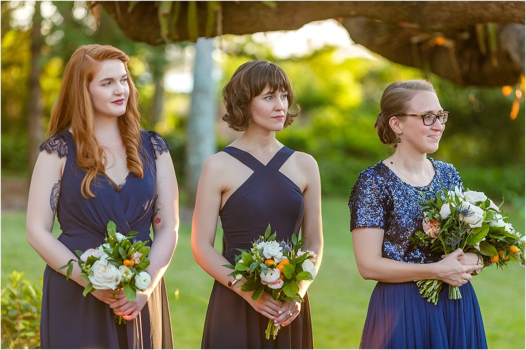 the bridesmaids smile as their friends exchange vows