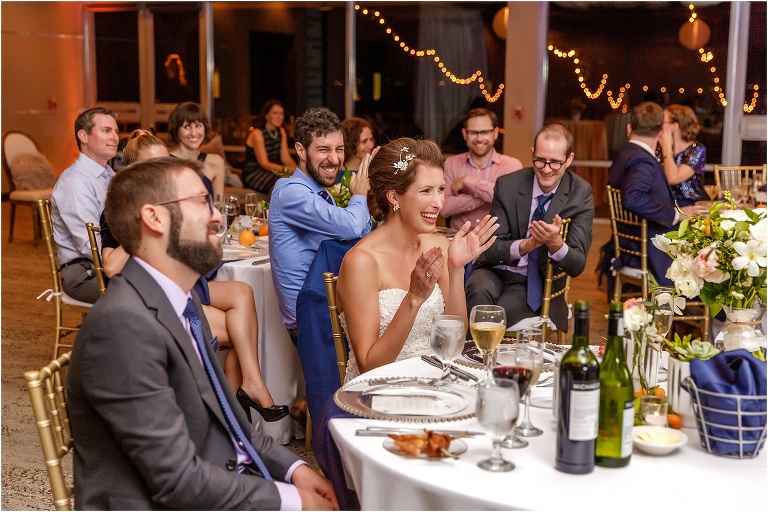 the bride and groom in hysterics during one of their toasts