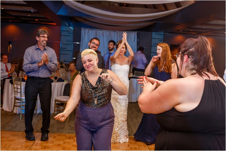 the groom's sister bustin a move on the dance floor