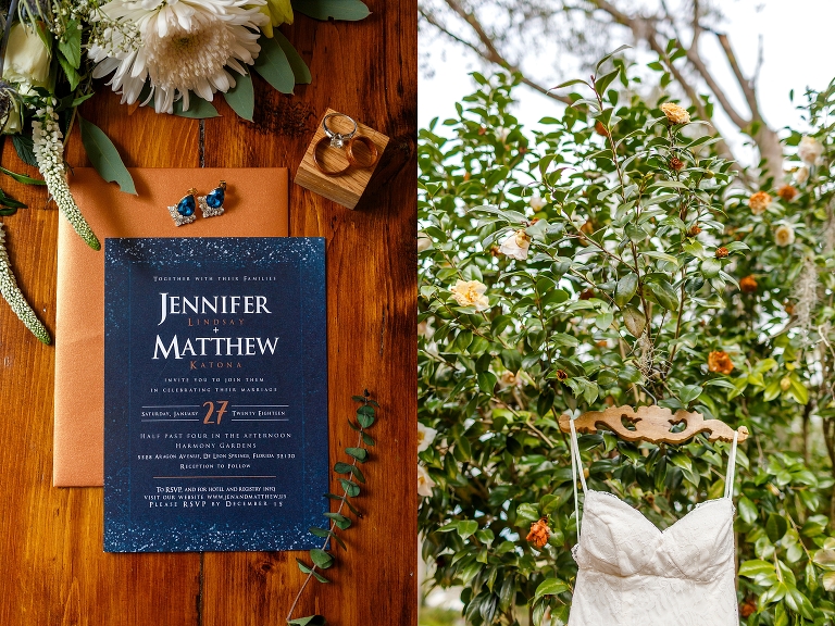 side by side, on left, navy and gold custom wedding invitation suite from The Joy Co., on right, bride's Galina wedding dress hanging from a beautiful tree