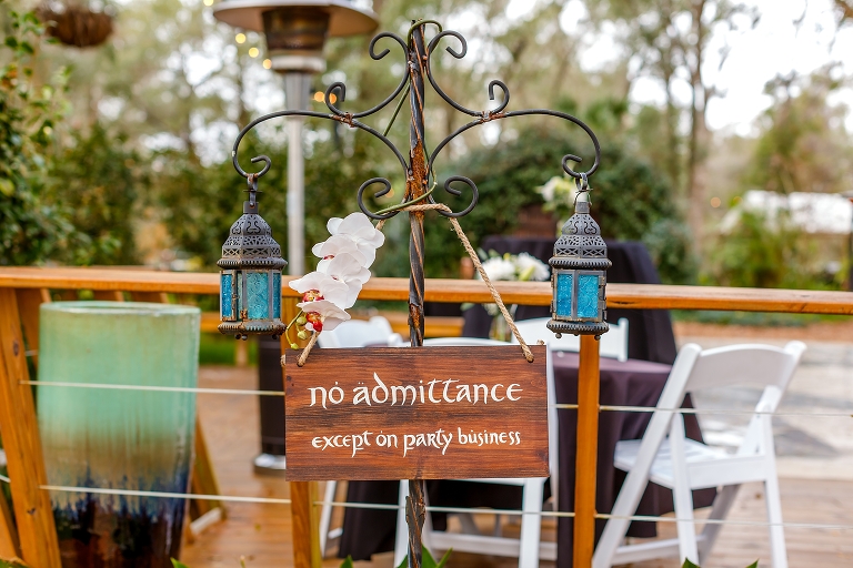 handmade signs helped set the mood at their DIY garden wedding