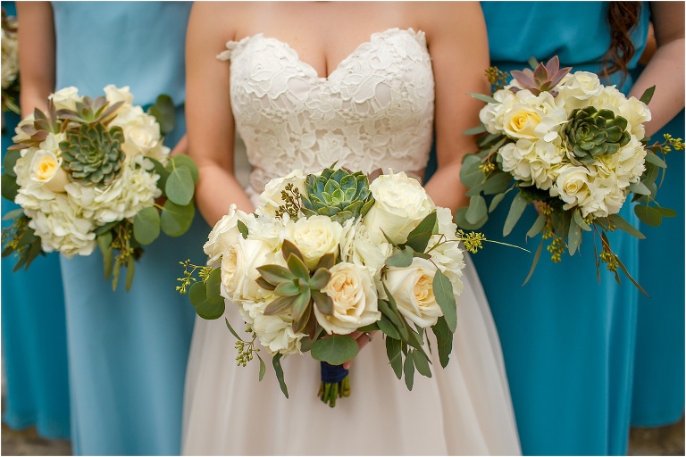 Bridal bouquet by Jennie's Flowers complete with white roses and succulents