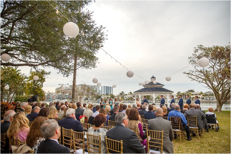 The guests looking on as they exchange vows at their Florida garden wedding at the Davis Island Yacht Club 