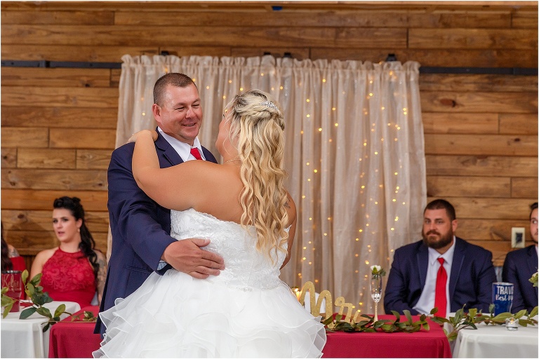 the bride shares a dance with her father at their Hidden Barn Venue wedding reception