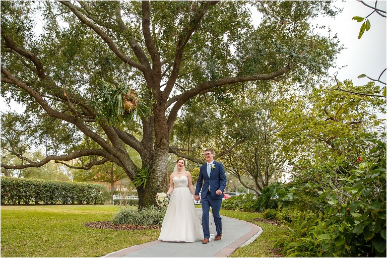 the bride and groom take their first walk as husband and wife after their Davis Island Yacht Club ceremony