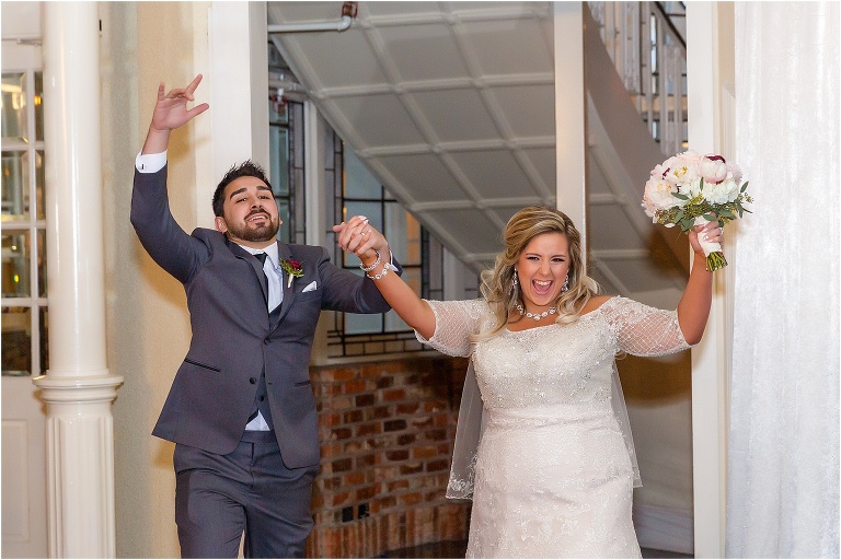 the bride and groom are announced into their Orchid Garden Orlando reception