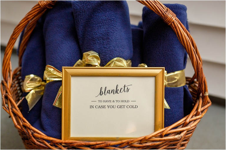the bride & groom provided navy blankets to warm up their guests during Florida's one cold snap