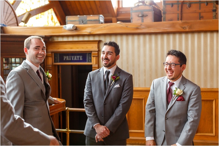the groom and his groomsmen share a laugh as they relax at Cheyenne Saloon before the ceremony