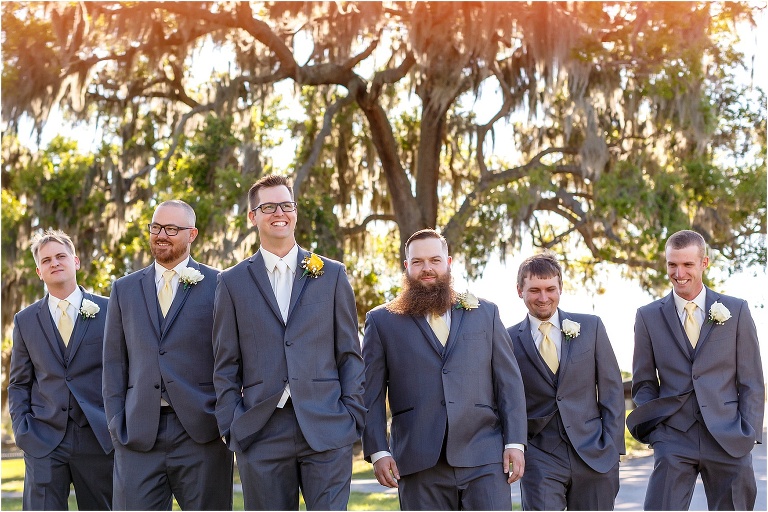 the groom & his groomsmen take a stroll before his Cottom Farm wedding