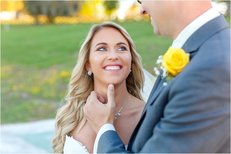 the bride's brilliant blue eyes looking up at her husband during their Cottom Farm wedding
